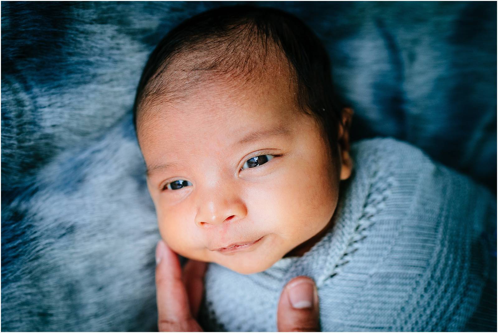 cute newborn baby in blanket